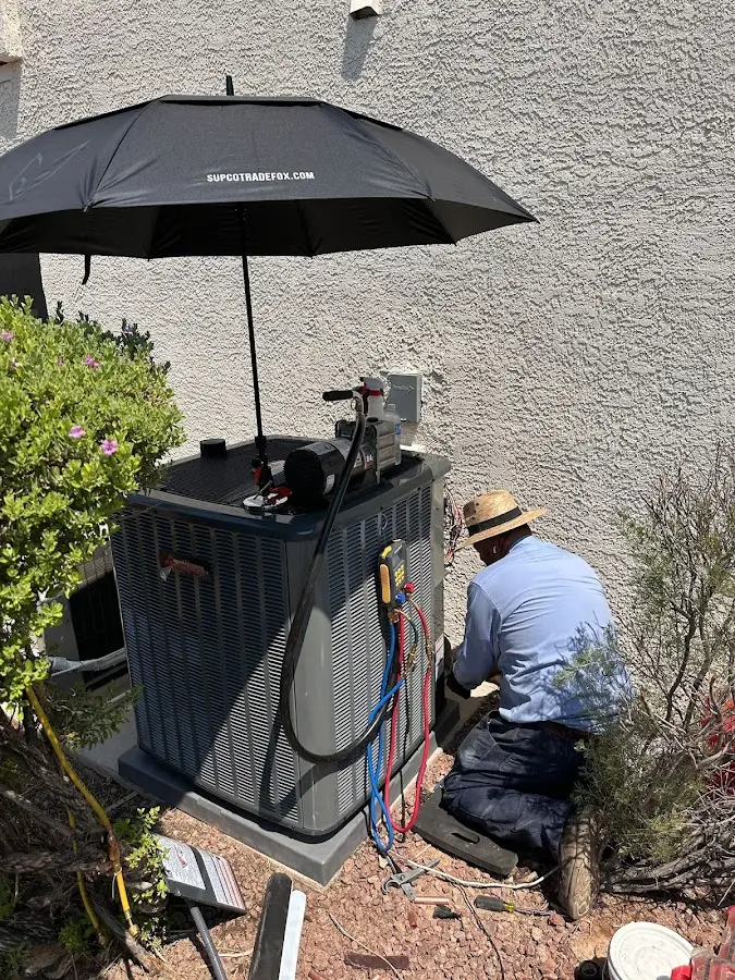 HVAC technician performing outdoor AC maintenance in Mission Viejo
